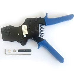 Wire stripping tool with blue handles and a small detachable component placed beside it.