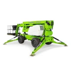 Green mobile elevated work platform with extended stabilizers, designed for outdoor use and heavy-duty tasks.