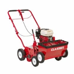 Red lawn aerator with black and white engine, designed for turf maintenance and improving soil aeration.