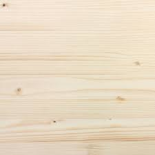 Light wooden surface with visible grain patterns and small knots, providing a natural and textured background.