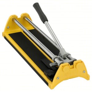 Yellow and black manual tile cutter with a handle on a white background.