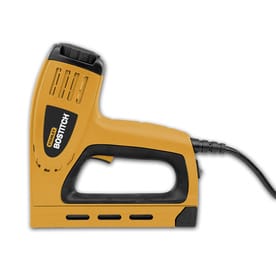 Yellow and black electric staple gun with a cord, shown from the side.