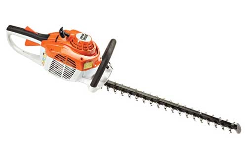 Gas-powered hedge trimmer with orange motor housing and long black blade for trimming bushes and hedges.