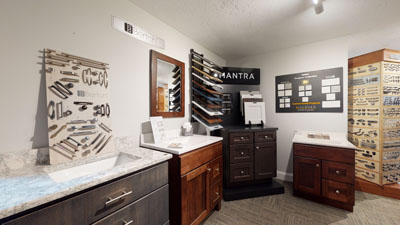 Showroom displaying various kitchen cabinet samples and designs.