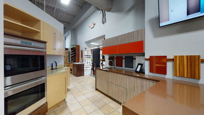 modern kitchen showroom with various cabinetry designs and appliances
