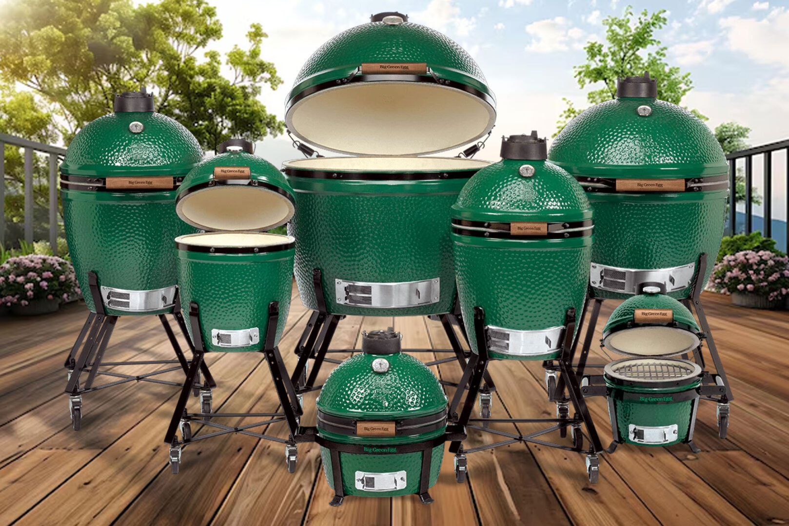Seven green ceramic outdoor grills on a wooden deck, varying in size, with a natural background.